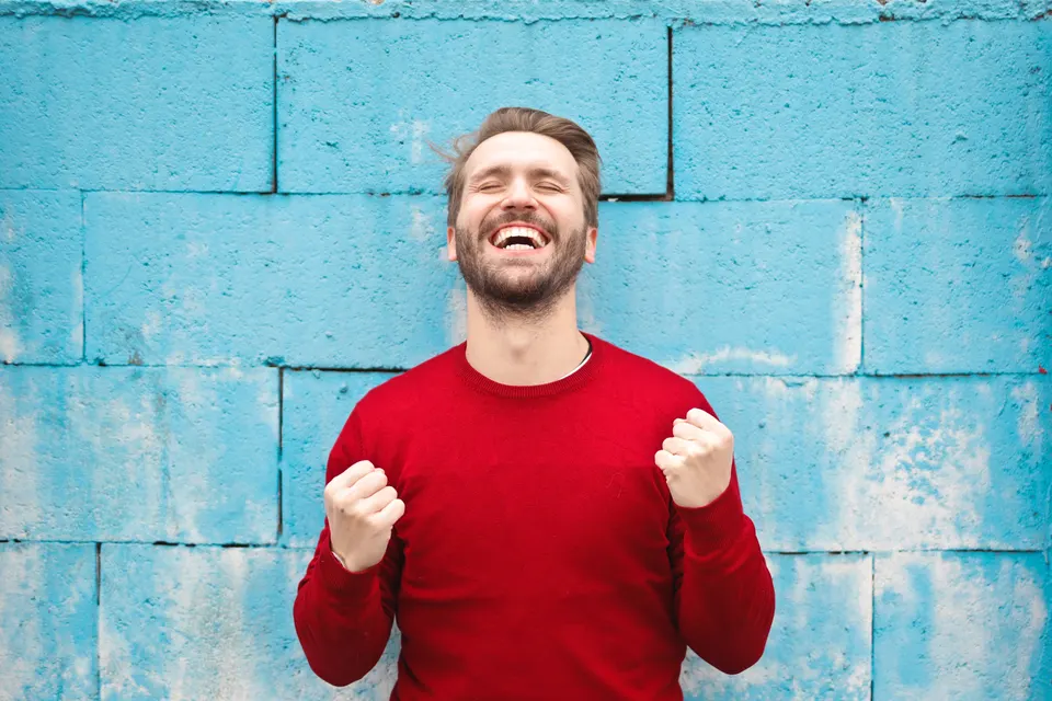 Man celebrating jigsaw puzzle